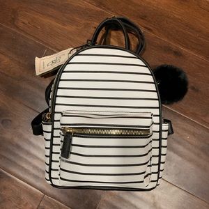 Mini backpack with pom-pom